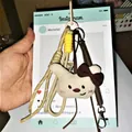 Cute cream plush bunny keychain with red bow and khaki braided strap accessory - Spring Rope Pendant / Bowknot Rabbit