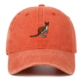 Close-up of kangaroo embroidery on a vintage coral orange washed cotton baseball cap - Orange