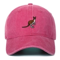 Macro view of kangaroo embroidery detail on washed pink vintage cotton baseball cap - Rose Red
