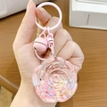 Portachiavi a forma di rosa rosa con campanello e gancio su sfondo di legno - Forma Rosa Fiore Rosa (Quicksand Pink Bean)