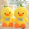 Pair of yellow plush duck toys with blue checkered bows and green sprout head decor - Bow Tie Duck 30 Cm / Price And Color Are Random For Single Pieces Around 40cm In Length.