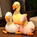 Large plush goose toys in white, yellow, and pink colors with orange floral scarves - Scarf Sitting On A Goose 33 Cm / Price And Color Are Random For Single Pieces Around 40cm In Length.