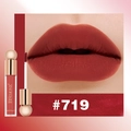 Macro detail of matte liquid lipstick in shade #719 with waterproof finish - Rust Red (#719)