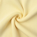 Close-up of pale yellow knitted fabric with fine ribbed texture and soft finish - S / Yellow