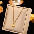 Detail view of 18k gold evil eye pendant necklace with crystals on a jewelry display - Oval Evil Eye Style (CYN083B)