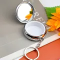 Polished silver portable metal pill box with mirror and keychain attachment - Round No Compartment Keychain With Mirror