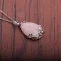 Macro view of teardrop rose quartz pendant with intricate silver floral metalwork detail - Rose Quartz Water Drop (NSN0027)