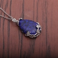 Macro detail of tear-drop lapis lazuli pendant with intricate silver floral engraving - Lapis Lazuli Water Drop (NSN0026)