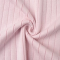 Detailed view of light pink ribbed knit fabric showing soft texture and high elasticity - S / Pink