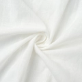 Macro shot of white woven cotton fabric showing clear texture and breathable fibers - White (100% Cotton)