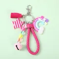 Rainbow and macaron star keychain with pink tassels and bell on light green background - Rose Red
