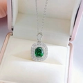Macro view of emerald necklace pendant with dual halo of pavé-set zircons on silver chain - Green Pendant (With Chain)