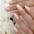 Classic white almond French press-on nails with a minimalist translucent nude pink base - Almond Shape