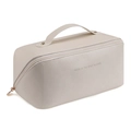 Detail view of cream leather makeup bag with gold hardware and top handle - Milky White