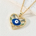 Macro shot of gold-plated heart evil eye pendant necklace with colorful zirconia stones - Style S-Heart-shaped Evil Eye with Colorful Stones