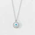 Silver evil eye necklace with blue zircon center and radiant crystal halo design - Style W-Silver Tone Radial Zirconia