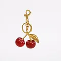 Sparkling red resin cherry keychain with gold metal leaf and lobster clasp on white background - Red Cherry 32MM