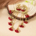 Detail of vintage gold Indian style earrings with red beads and dangling bell tassels - Gold with Red (EA116)