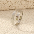 Close-up of minimalist silver double-layer spiral open ring on textured beige surface - Silver Spiral Open Ring
