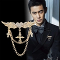 Gold wing heart brooch with rhinestones and tassel chains worn on a black suit lapel - Gold Wing Cross