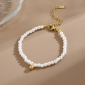 Elegant white pearl bracelet with gold bead accent and K18 engraved extension chain - E100 Pearl Bracelet Gold