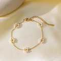 Titanium steel bracelet with white pearl daisies in golden finish and adjustable chain - E2213 Five Pearl Flower Bracelet Gold