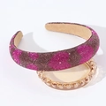 Detail shot of wide padded headband with pink and coffee rhinestones on glass tray - Brown Red Heart