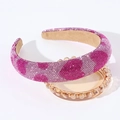 Close-up of pink rhinestone padded headband featuring intricate crystal patterns - Pink Heart