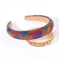 Close-up of padded headband with colorful rhinestone heart patterns and sponge design - Brown Rainbow Heart