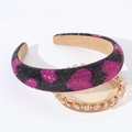 Detail view of padded rhinestone headband with pink hearts and anti-slip lining - Black Red Heart