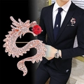 Rose gold dragon brooch with crystal pavé and red gemstone on a black suit jacket - Gold Dragon Red Ruby