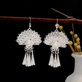 Ethnic peacock drop earrings with silver tassels and intricate filigree design - Silver Peacock Tassel Drop Earrings
