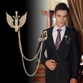 Gold winged heart and sword brooch with rhinestone details and musical note chain link - Gold Winged Note