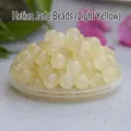Macro view of polished light yellow Hetian jade loose round beads for DIY jewelry - Hetian Light Yellow Water Color / 8mm