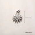 Macro view of sun charm pendant with spiral pattern and 13mm by 10mm dimensions - Platinum Shiny Small Sun (A889)