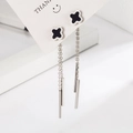 Silver four leaf clover tassel earrings with long drop pendant on white display card - White Gold