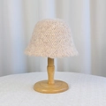 Winter apricot knit bucket hat with hollow crochet texture on a wooden stand - Crochet Hollow Wavy Brim (8980) / Oatmeal