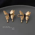 Golden butterfly waist buckle with black gemstone inlay for pants adjustment, size 3cm - Gold Enamel Butterfly
