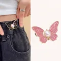 Adjustable butterfly waist tightener buttons in black and pink with imitation pearl detail - Patterned Pink Pearl Butterfly