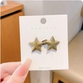 Star-shaped adjustable waist buckle in antique gold finish on a display card - Bronze Star Waist Buckle