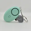 Mint green portable personal safety alarm with keychain and braided lanyard - Green