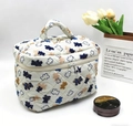 Quilted cotton toiletry bag in cream white with blue floral print and handle - Bears on White