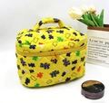 Yellow quilted cotton makeup bag with colorful bear prints and top handle on white background - Bears on Yellow