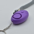 Purple portable personal security alarm with stainless steel keychain for women's safety - Light Purple