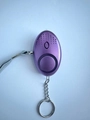 Purple oval personal alarm device with non-slip texture, keychain, and wrist lanyard - Purple