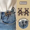 Bear-shaped waist adjuster buttons in bronze finish for denim pants resizing - Copper