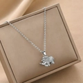 Sparkling silver elephant pendant necklace with zircon inlay on a jewelry box - Silver