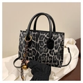 Chic leopard print handbag with black handles and elegant golden hardware details - With Pendant / Black