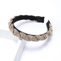 Crossed velvet headband featuring sparkling crystal rhinestones in a luxury vintage design - Gold