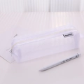White mesh pencil case with zip closure and minimalist brand label on desk - White